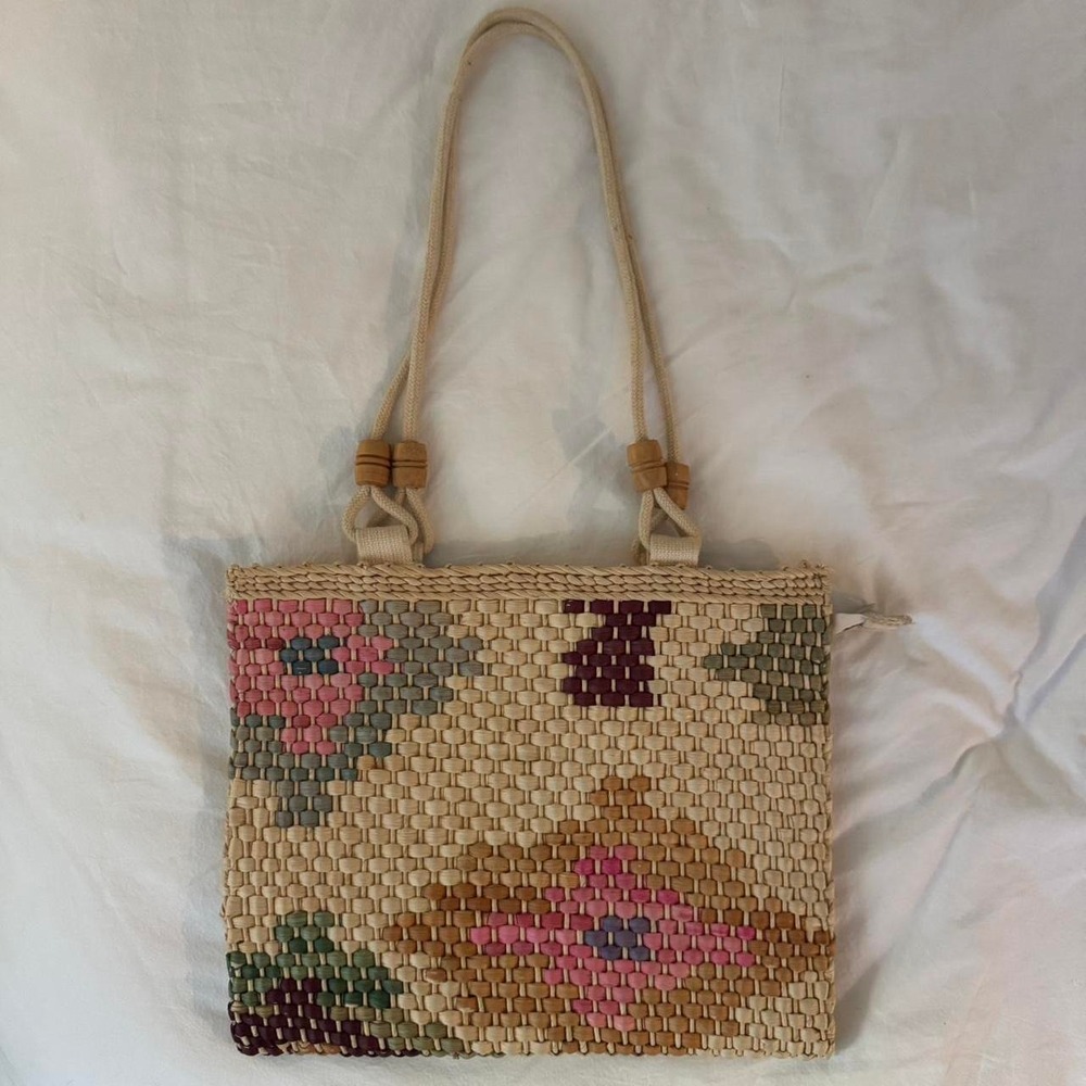 Cream and pink woven straw bag with a boho vibe